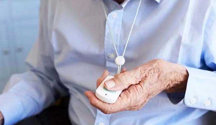 old men points to emergency medical pendant button